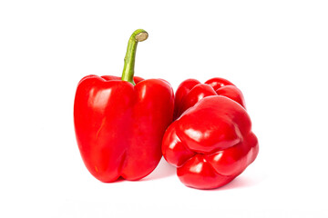 Three red peppers on a white background