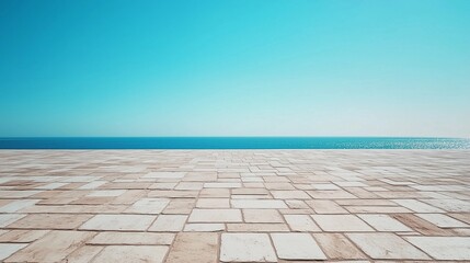 Paving tiles arranged symmetrically by the seaside under a clear blue sky during daylight