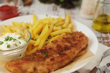 Fish and chips served on the plate, traditional dish of Great Britain
