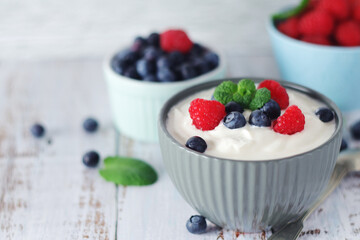 A bowl with Greek yogurt with berries	