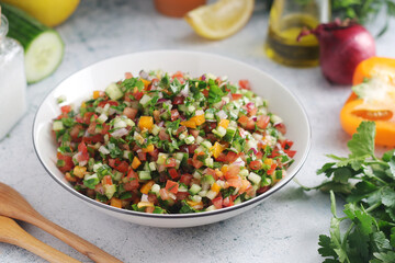 A bowl with traditional Israeli Salad