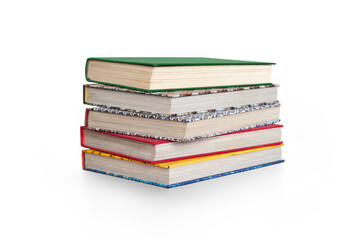 A pile of traditional real books used for education at schools and universities for learning and...