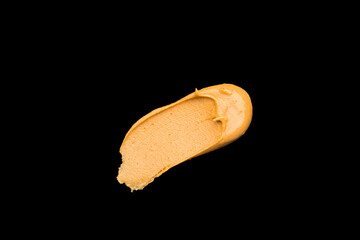 Delicious and healthy peanut butter on black background	