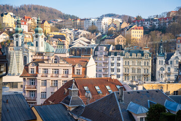 Rooftops of historic buildings in Karlovy Vary, showcasing elegant architecture and scenic city...