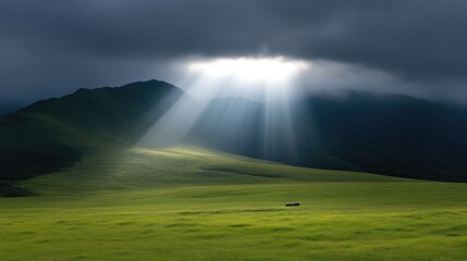 Sunbeams pierce a valley