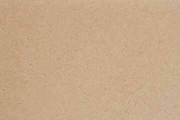 Recycled cardboard texture with tiny colored specks and fibers. Ecologic background, copy space....