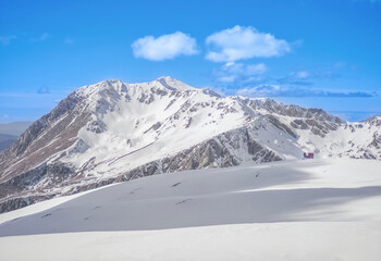 Ovindoli (Abruzzo, Italy) - The Monte della Magnola is a imponent and suggestive mountain peak in Abruzzo, above the ski resorts of Ovindoli, here during the winter with snow and alpinists.