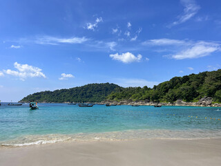 Beautiful Tropical Beach with Longtail Boats on Turquoise Waters in Phuket, Thailand