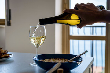 Hand holding a glass of wine