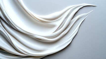 Obraz premium Elegant white silky fabric waves creating smooth flowing curves and gentle folds against light background. Luxurious textile with soft shadows and highlights.