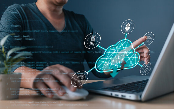 professional uses a laptop with a holographic cloud computing, symbol cloud technology, digital transformation, data management, cybersecurity, and system efficiency in modern tech solutions.