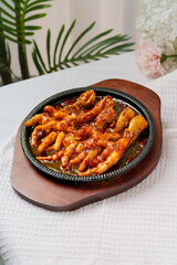 Tiger skin chicken feet on white background