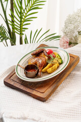 Western-style roasted chicken and side dishes on a monochrome background