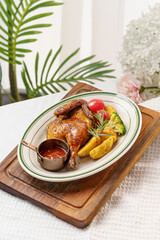 Western-style roasted chicken and side dishes on a monochrome background