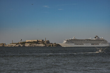 Luxury cruiseship cruise ship liner Serenity sail away departure from San Francisco port through...