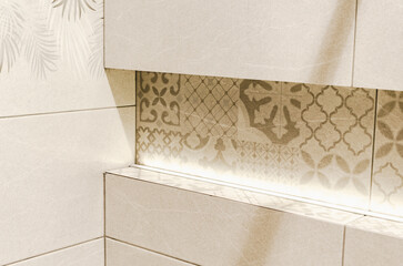 Beige Patterned Wall Tiles with Subtle Lighting