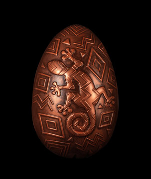 A chocolate Easter egg with intricate tribal patterns, inspired by traditional art. Isolated on a black background.