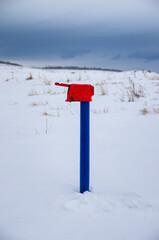 A water column in the field in winter.