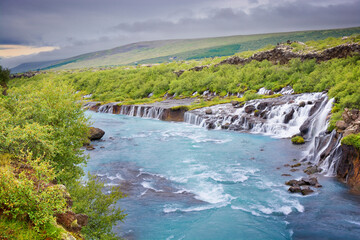 Hraunfossar - series of waterfalls formed by rivulets streaming over a distance of about 900 metres...