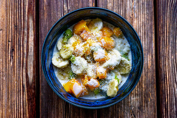 Tropical Rice Pudding with Mango, Kiwi, Banana, Sesame and Coconut