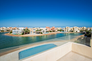 View over sea lagoon in tropical luxury apartment resort