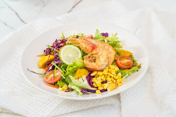 Mixed fruit and vegetable salad on a simple background