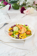 Mixed fruit and vegetable salad on a simple background