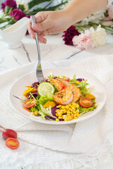 Mixed fruit and vegetable salad on a simple background