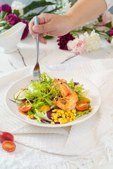 Mixed fruit and vegetable salad on a simple background
