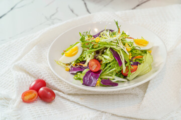 Mixed fruit and vegetable salad on a simple background