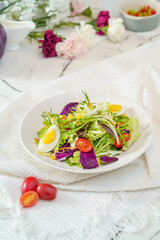 Mixed fruit and vegetable salad on a simple background