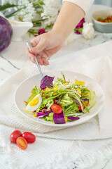 Mixed fruit and vegetable salad on a simple background
