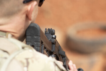Focused Precision: Soldier Aiming a Rifle