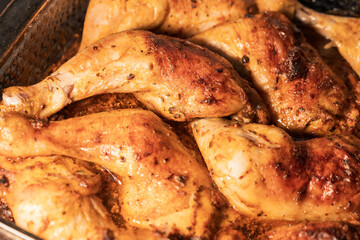 baked chicken on a platter, lots of fried chicken to eat