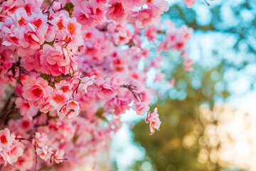 pink decorative flowers on an artificial tree