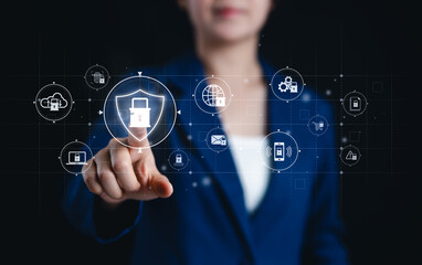 Cybersecurity and digital authentication concepts. Businesswoman interact with cybersecurity icons, data protection, authentication, encryption, secure communication, and cyber security measures.