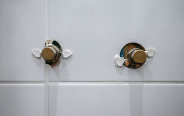 Metal caps used to seal pipes when removing a faucet.