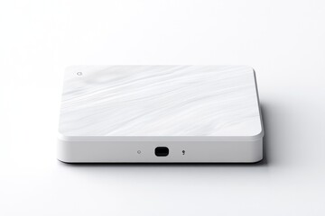 Modern, square device with smooth, textured surface