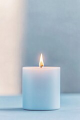 close-up of single lit candle in dimly lit room warm flame flickering gently against blurred soft background