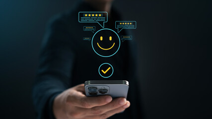 Satisfaction survey, customers use smartphones to rate their experience with five stars, online application services with happy smiley icons, feedback, service quality business reputation rankings.