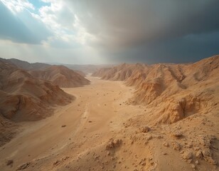 Naklejka premium Vast Judean Desert aerial view under cloudy sky in Israel. Scenic mountains, rugged terrain. Arid landscape, remote wilderness, earth environment, travel destination. Serene tranquility, adventure