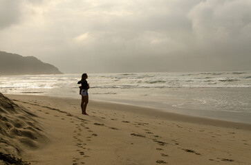 young woman running on the beach