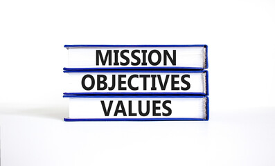 Mission objectives values symbol. Concept words Mission Objectives Values on beautiful blue white books. Beautiful white background. Business mission objectives values concept. Copy space.