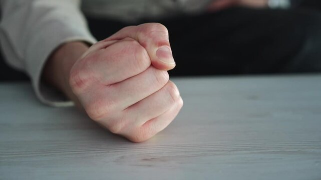 Angry man banging his fist on the table.
Man commands you to be angry,
Angry man.
Angry guy's fist.
Emotions, anger, rage, wrath