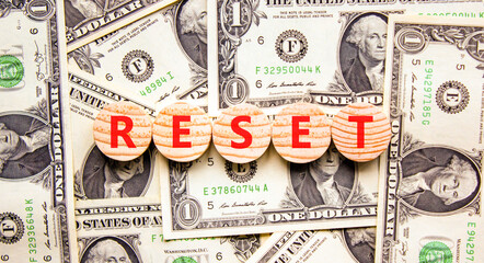 Reset symbol. Concept word Reset on beautiful wooden circles. Beautiful dollar bills. Beautiful...