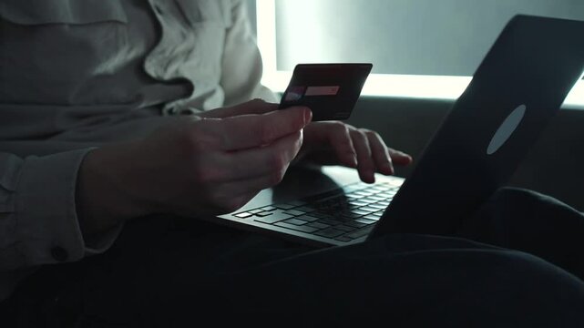 Credit card in close-up in the rips of a business man