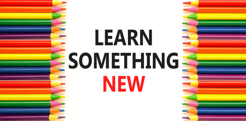 Learn something new symbol. Concept words Learn something new on beautiful white paper. Beautiful white background. Colored pencils. Business motivational learn something new concept. Copy space.