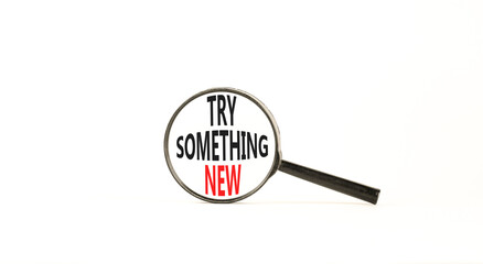 Try something new symbol. Concept words Try something new in beautiful magnifying glass. Beautiful white background. Business motivational lifestyle try something new concept. Copy space.