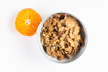 granola bowl cereal flakes orange separate on white background