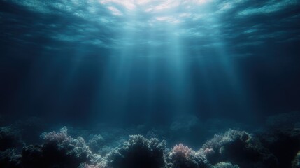 Obraz premium Sunlight pierces deep ocean, coral reefs